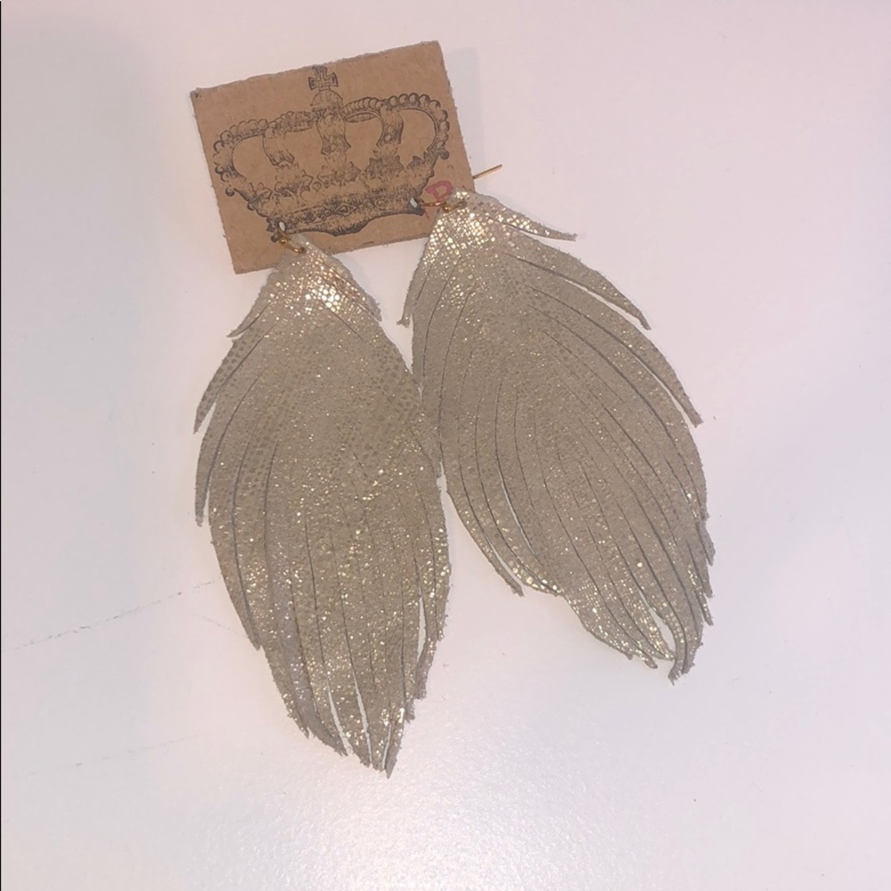 Custom made leather earrings by Crown B crafts.